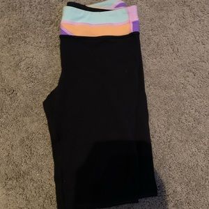 Black ivivva leggings with a patterned waist band